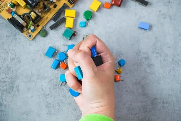 A close-up shot of a child's hands building a circuit board with snap-together electronic components from a STEM toy kit on a desk.