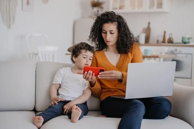 A close-up of a mother pre-ordering a toy on her laptop, with her excited child looking over her shoulder, illustrating the convenience and anticipation of online pre-ordering.