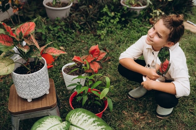 A young boy is kneeling in a garden, carefully planting a seedling. He is surrounded by gardening tools and has a focused expression. There are flowers and vegetables already growing in the garden.