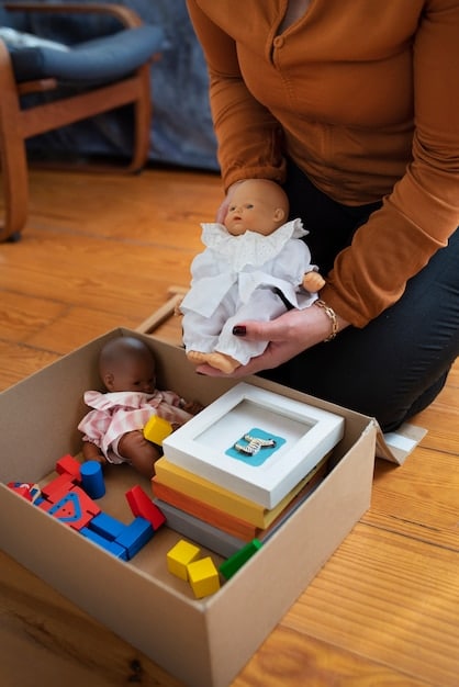 A close-up shot of a child helping a parent sort toys into separate labeled bins: 