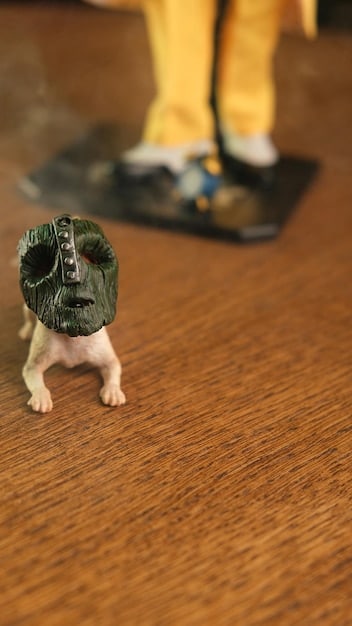 A close-up shot of a retro-style action figure from the 1980s, still in its original packaging. The background should be blurred, focusing attention on the detail and condition of the vintage toy.