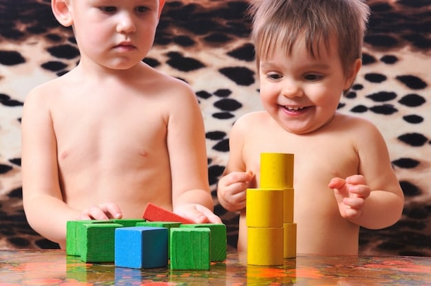 A close-up shot featuring a child happily playing with a set of wooden building blocks. The blocks are brightly colored with non-toxic stains and are designed with smooth, rounded edges for safety. The background is a soft, natural setting, suggesting an eco-friendly home environment.