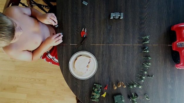 A bird's-eye view of a child playing with a toy subscription box, focused on STEM activities. The child is surrounded by scientific instruments, construction toys, and art supplies. The setting suggests a home-based learning environment with educational enrichment.