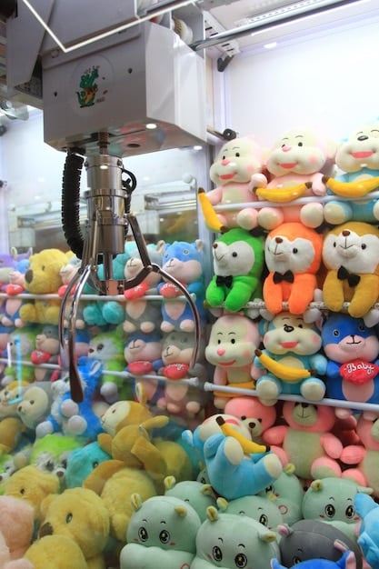 A photograph depicting workers in a plush toy factory operating in fair and safe conditions, highlighting ethical production practices.