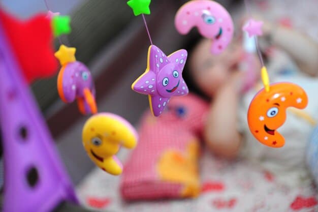 A close-up shot of a baby, around 6-8 months old, happily grasping and exploring a soft, colorful plush toy. The toy is designed with a variety of textures and patterns to stimulate the baby's senses.