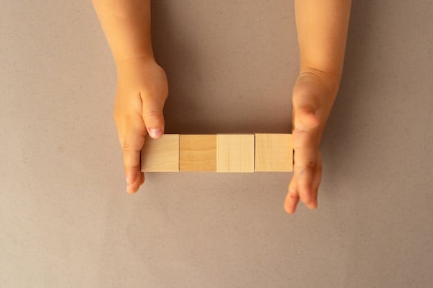 A close-up shot of a child's hands playing with wooden building blocks, showcasing the smooth texture and vibrant colors of the wood. Focus on the interaction between the child and the toy, highlighting the tactile experience.