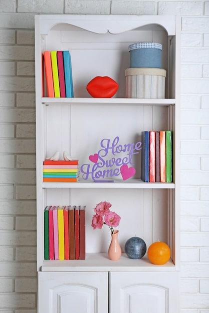 A well-organized shelving unit in a playroom, featuring a mix of open shelves and closed cabinets. Various toys, books, and decorative elements are neatly arranged, showcasing the shelving unit's capacity and aesthetic appeal.