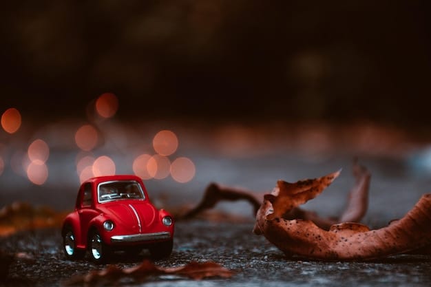 A close-up shot of a toy car on a miniature road, with soft, diffused light coming from the side. The light highlights the textures and contours of the car, while the background is gently blurred to create depth.