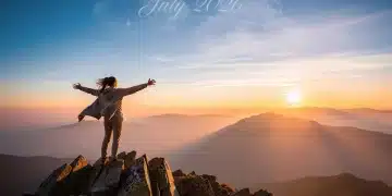 Person achieving mountain top goal, symbolizing simplified goal setting success by July 2026
