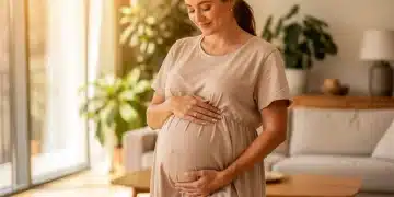 Pregnant woman cradling belly, symbolizing healthy gestational development